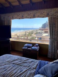 Uma cama ou camas num quarto em Linda casa frente a la playa, Maitencillo, Reservar con más de un día de anticipación