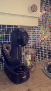 a coffee maker on a counter in a kitchen at Be's Cottage in Malin Head