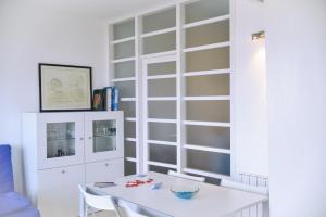 Televízia a/alebo spoločenská miestnosť v ubytovaní L'Escala Vista Mar