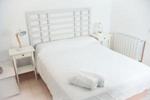Posteľ alebo postele v izbe v ubytovaní L'Escala Vista Mar