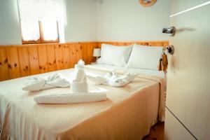 Voodi või voodid majutusasutuse Hotel Domino toas