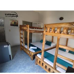 a room with two bunk beds in it at Tayrona Dive Center in Taganga