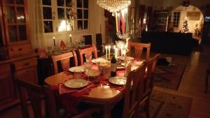 a dining room table with candles on top of it at Habitaciones Cómodas con baño individual in Santa Cruz de Tenerife