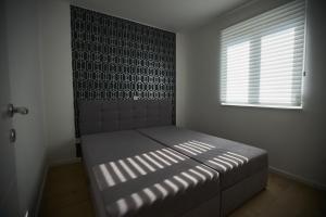 Postel nebo postele na pokoji v ubytování Sonia Apartman