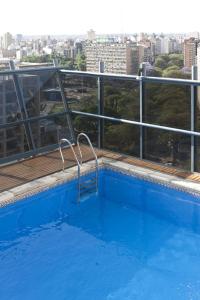 a swimming pool on the roof of a building at NH Córdoba Urbano in Cordoba