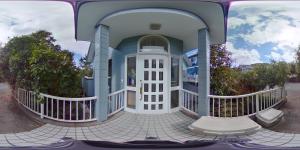 a front view of a house with a porch at Holiday Home Apple in Ito +10 photos