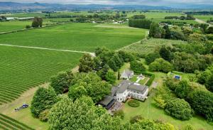 an aerial view of a large house in a field at The Marlborough in Blenheim