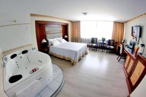 Postel nebo postele na pokoji v ubytování Hotel Oro Inn