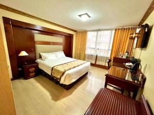 Postel nebo postele na pokoji v ubytování Hotel Oro Inn
