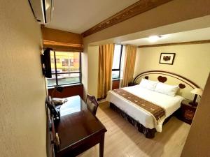 Postel nebo postele na pokoji v ubytování Hotel Oro Inn