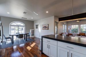 a kitchen and living room with a table and chairs at PHX Retreat Fully Remodeled Historic Home in Phoenix