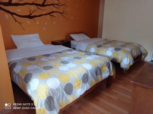 Nature Home Cusco客房内的一张或多张床位