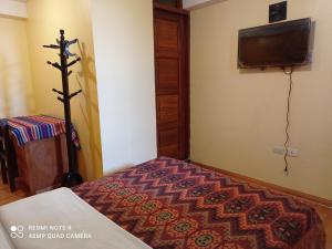 Кровать или кровати в номере Nature Home Cusco