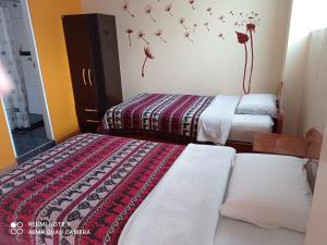 Cama o camas de una habitación en Nature Home Cusco