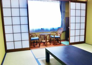 Postel nebo postele na pokoji v ubytování ATAMI SPRING TERRACE HOTEL