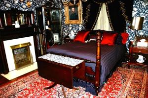 Postel nebo postele na pokoji v ubytování South Broadway Manor