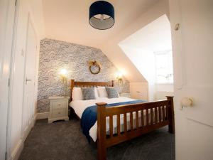 מיטה או מיטות בחדר ב-Sandpiper Cottage