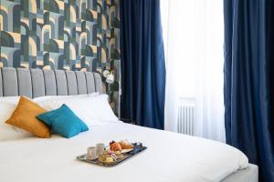 Postel nebo postele na pokoji v ubytování Il Pumo - Apulian Rooms Bari Calefati