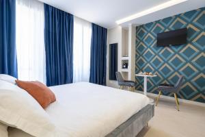Ліжко або ліжка в номері Il Pumo - Apulian Rooms Bari Calefati