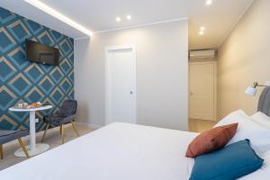 Postel nebo postele na pokoji v ubytování Il Pumo - Apulian Rooms Bari Calefati