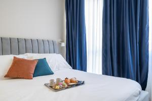 Postel nebo postele na pokoji v ubytování Il Pumo - Apulian Rooms Bari Calefati