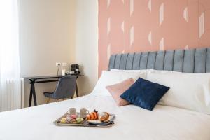 Postel nebo postele na pokoji v ubytování Il Pumo - Apulian Rooms Bari Calefati