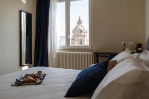 Postel nebo postele na pokoji v ubytování Il Pumo - Apulian Rooms Bari Calefati