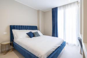 Postel nebo postele na pokoji v ubytování Il Pumo - Apulian Rooms Bari Calefati