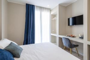 TV a/nebo společenská místnost v ubytování Il Pumo - Apulian Rooms Bari Calefati
