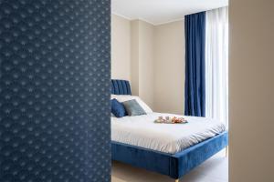 Postel nebo postele na pokoji v ubytování Il Pumo - Apulian Rooms Bari Calefati