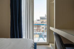 Postel nebo postele na pokoji v ubytování Il Pumo - Apulian Rooms Bari Calefati