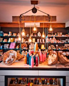 a store filled with lots of bottles on a counter at C Mauritius in Belle Mare