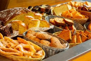 a table topped with lots of different types of pastries at Fasthotel Orleans Zénith in Orléans