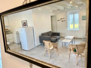 a living room with a couch and a table and chairs at COC - L'Étoile Du Marin in Wissant +14 photos