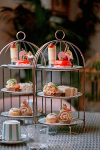 a three tiered display of pastries on a table at Imperial Hotel Cork City in Cork