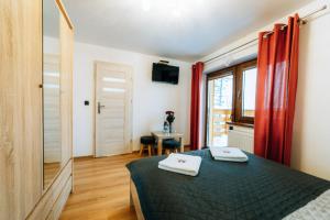 Un pat sau paturi într-o cameră la Polana Suche