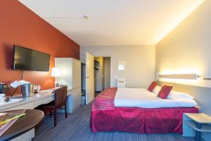 Postel nebo postele na pokoji v ubytování Hotel Ambiotel