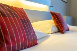 Postel nebo postele na pokoji v ubytování Hotel Ambiotel