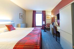 Postel nebo postele na pokoji v ubytování Hotel Ambiotel