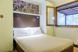 Posteľ alebo postele v izbe v ubytovaní Camping Village Rocchette