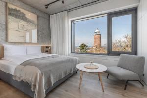 Posteľ alebo postele v izbe v ubytovaní Apartamenty z widokiem na morze i dziedziniec BalticON Morska 6