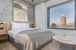 Posteľ alebo postele v izbe v ubytovaní Apartamenty z widokiem na morze i dziedziniec BalticON Morska 6