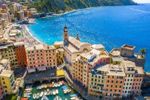 an aerial view of a city with boats in a harbor at La casa di Fede e Fran in Camogli
