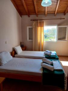 Postel nebo postele na pokoji v ubytování Chrysanthy Apartments