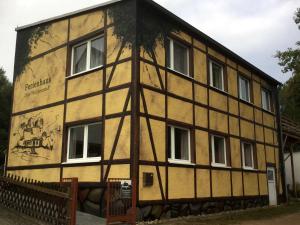 a building with a painting on the side of it at Waldmaries Ferienhaus in Feldberg