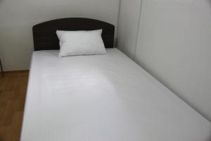 Postel nebo postele na pokoji v ubytování Dongdaemun Guesthouse