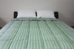 Postel nebo postele na pokoji v ubytování Dongdaemun Guesthouse