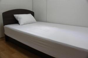 Postel nebo postele na pokoji v ubytování Dongdaemun Guesthouse