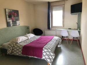 Postel nebo postele na pokoji v ubytování Abel Hôtel
