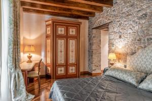 Postel nebo postele na pokoji v ubytování Bar Vitelli Charming suites + 37 fotografií